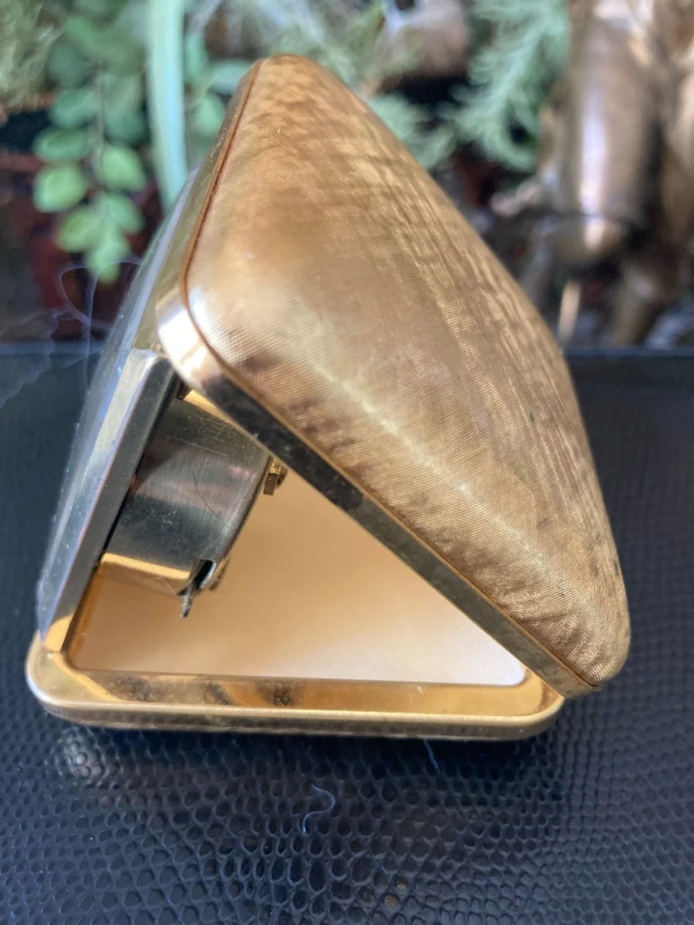 Classic mid-century Seth Thomas folding travel alarm clock in gold-tone texture